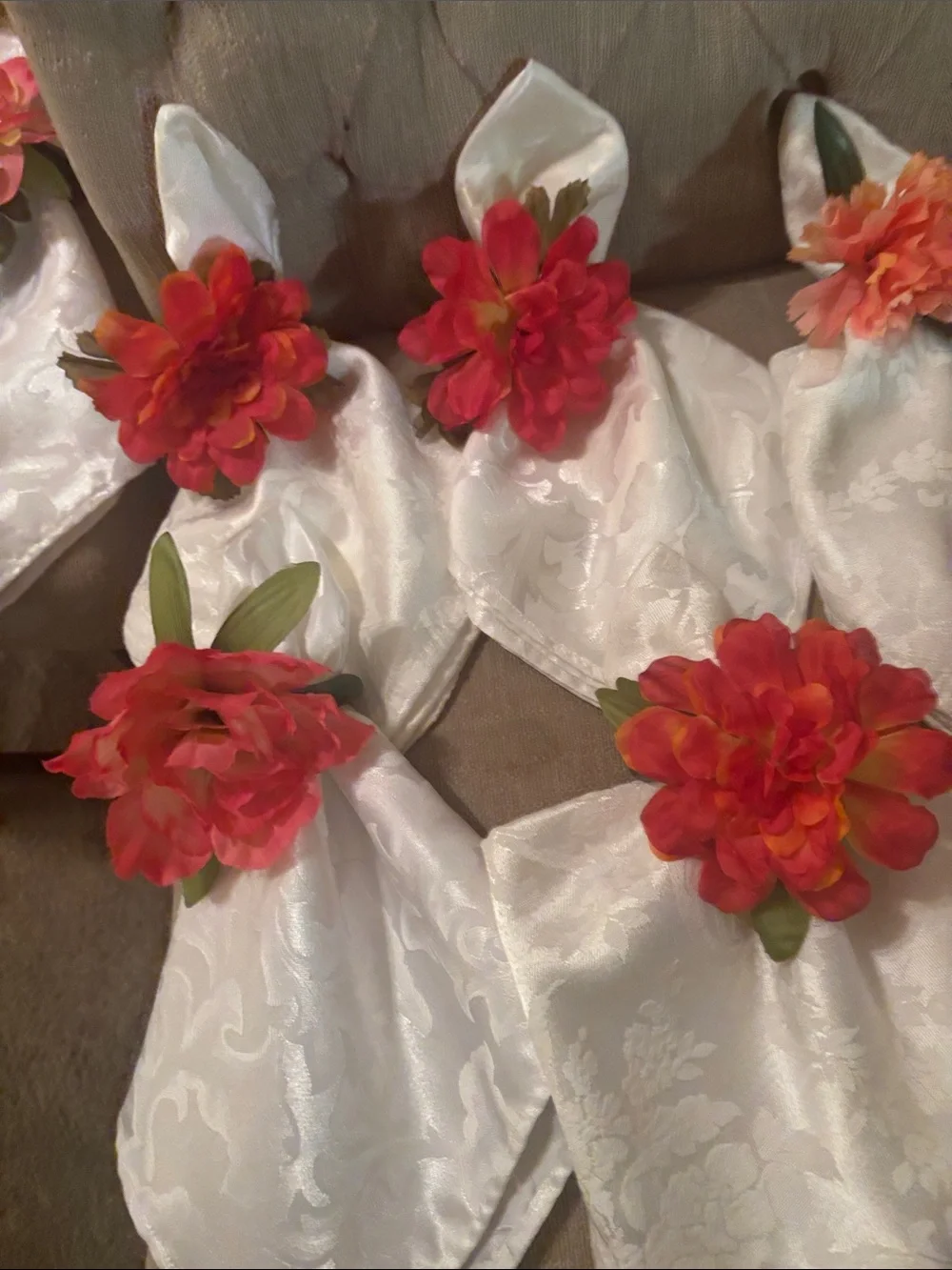 Six large easy care white napkins and 6  floral napkin rings.
